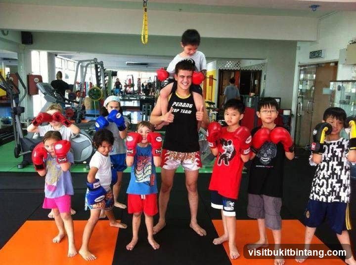 Children in boxing gloves at a gym