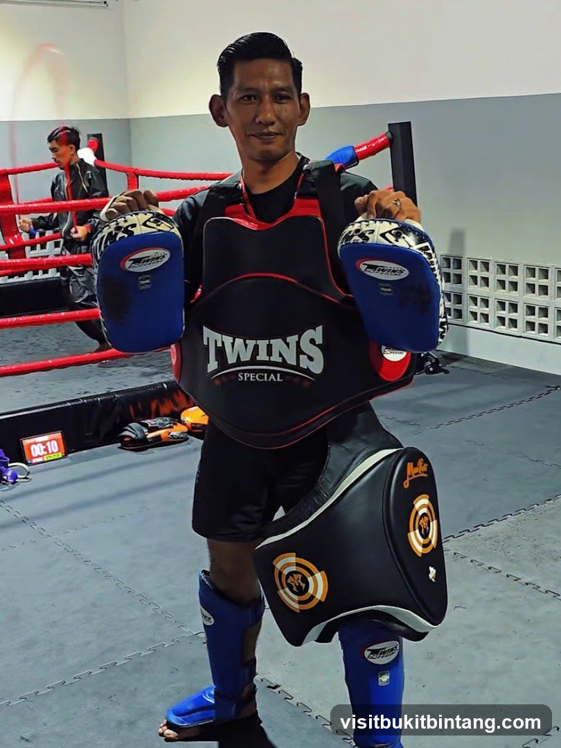 Muay Thai Trainer with Gear