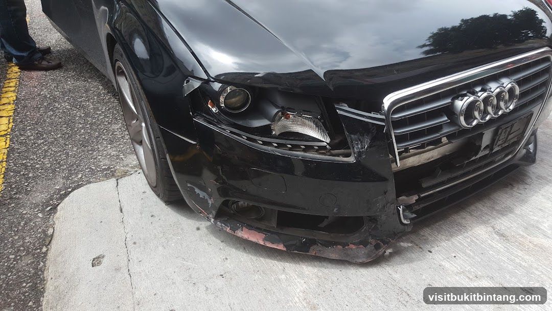Damaged Black Audi Car