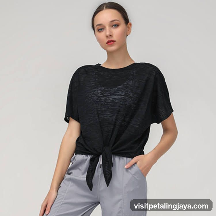Fashion Model Wearing Black Knotted T-Shirt and Grey Pants