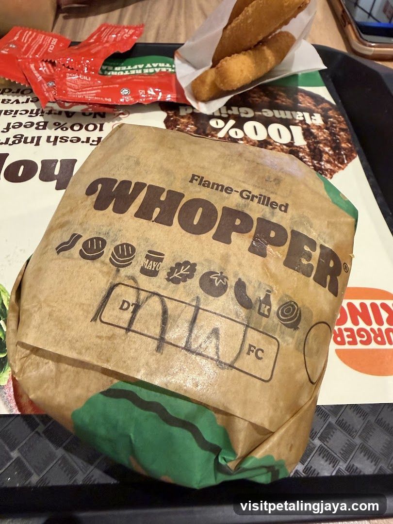 Burger in Wrapper with Condiments