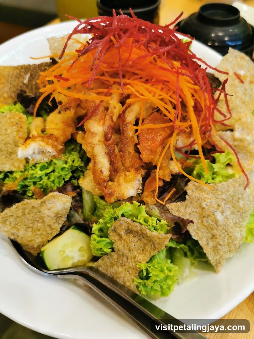 Fried Chicken Salad with Shredded Carrots and Red Onions