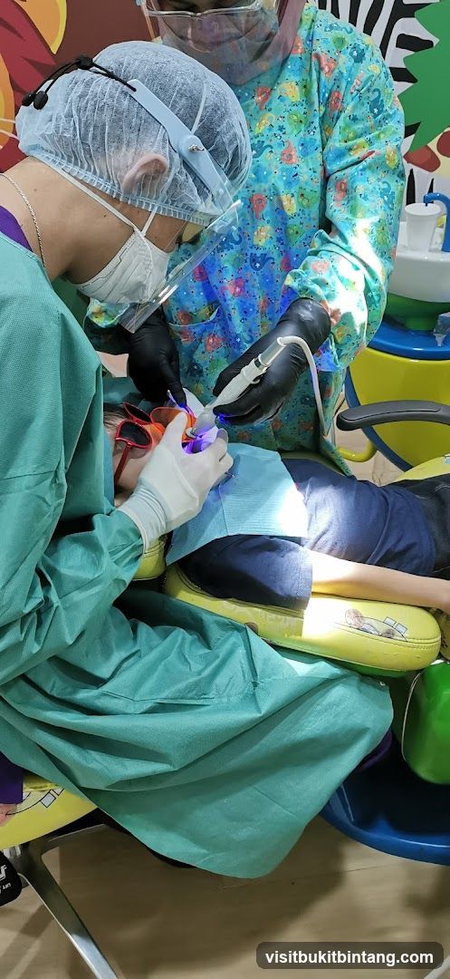 Dentist performing a procedure on a child
