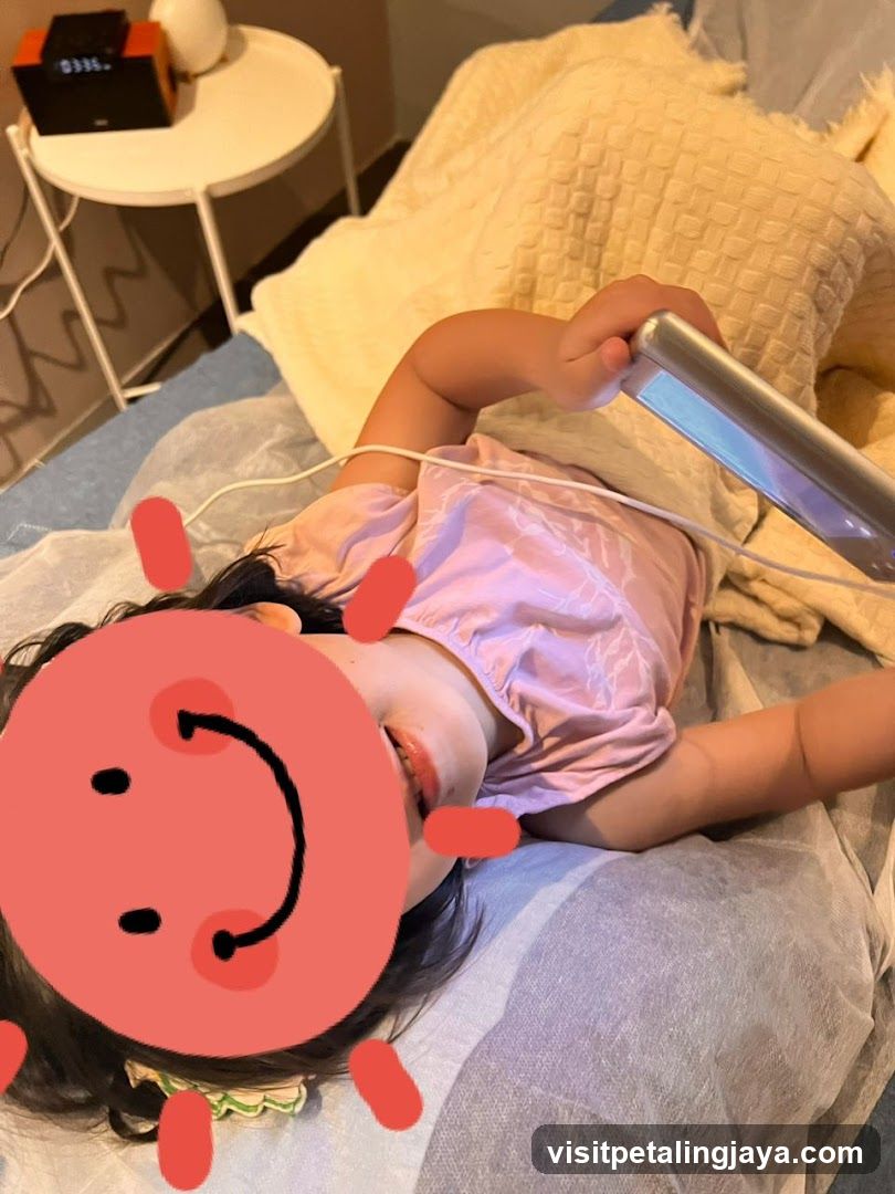 Child with device on bed