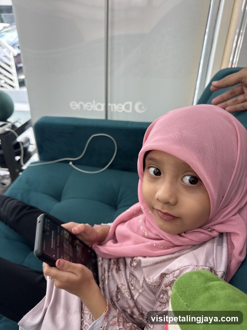 Girl with Pink Hijab Holding Phone