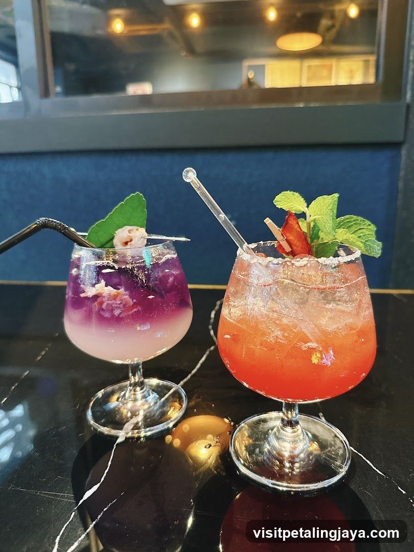 Two Colorful Cocktails on a Table