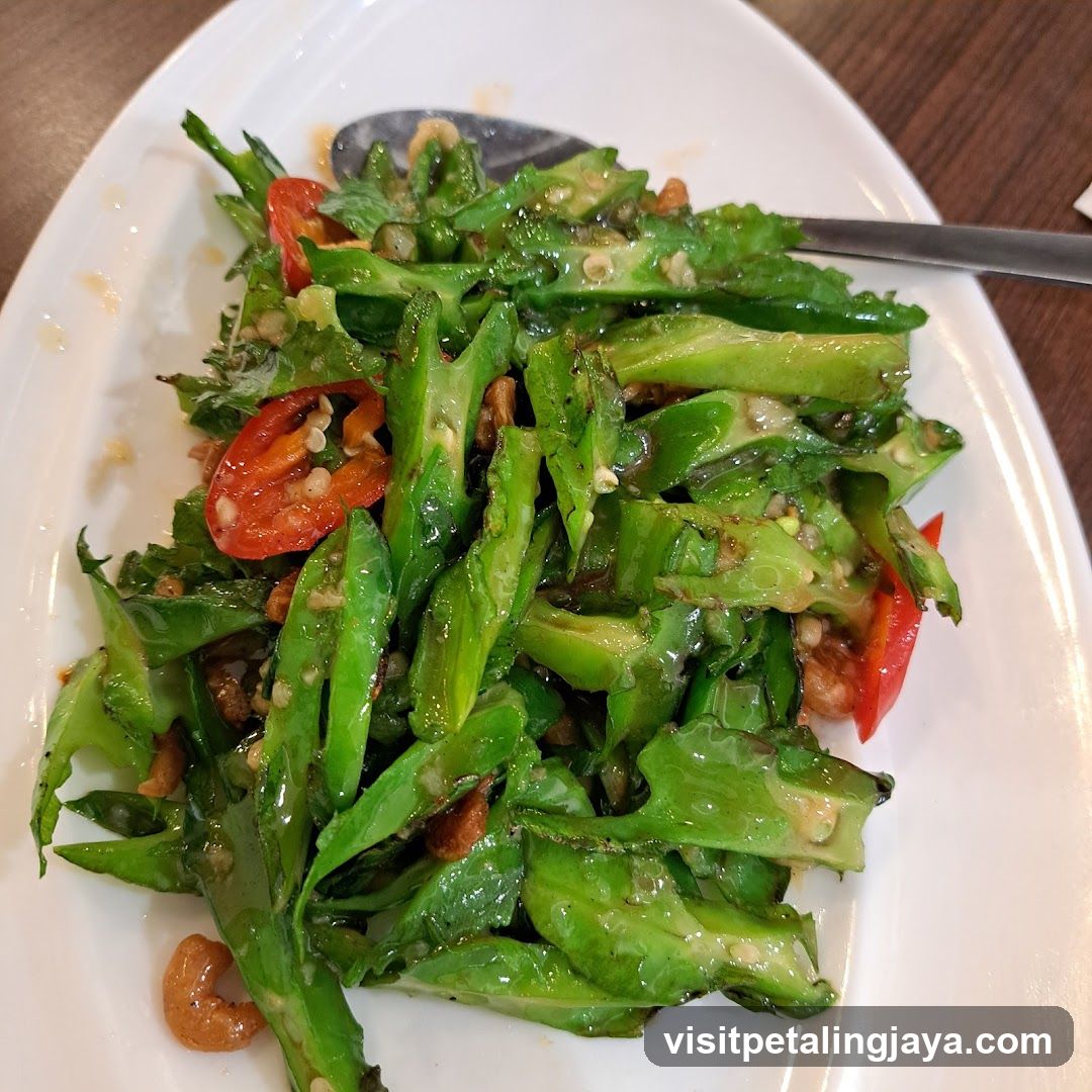 Stir-fried bitter melon with peanuts and chili