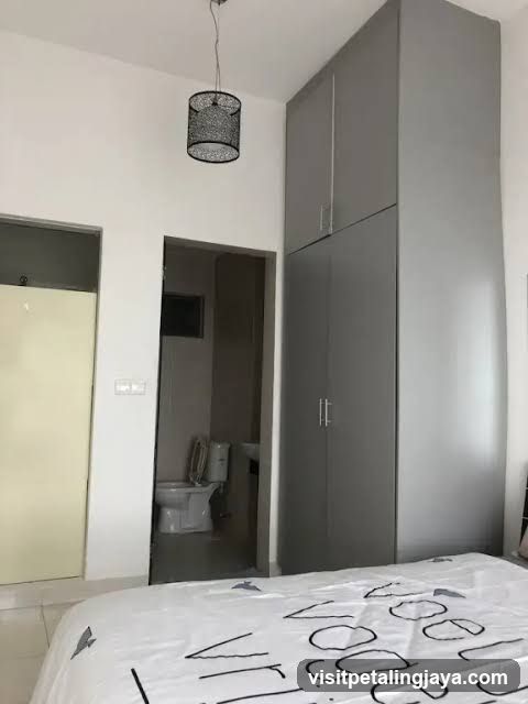 Bedroom Interior with Wardrobe and Bathroom View