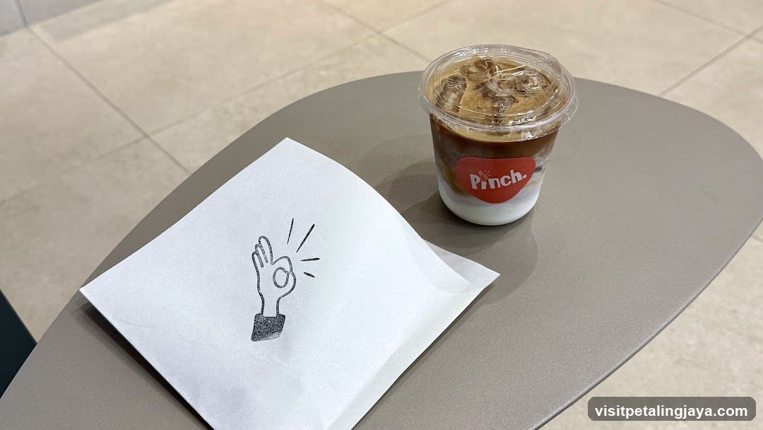 Iced Coffee and Napkin on Table