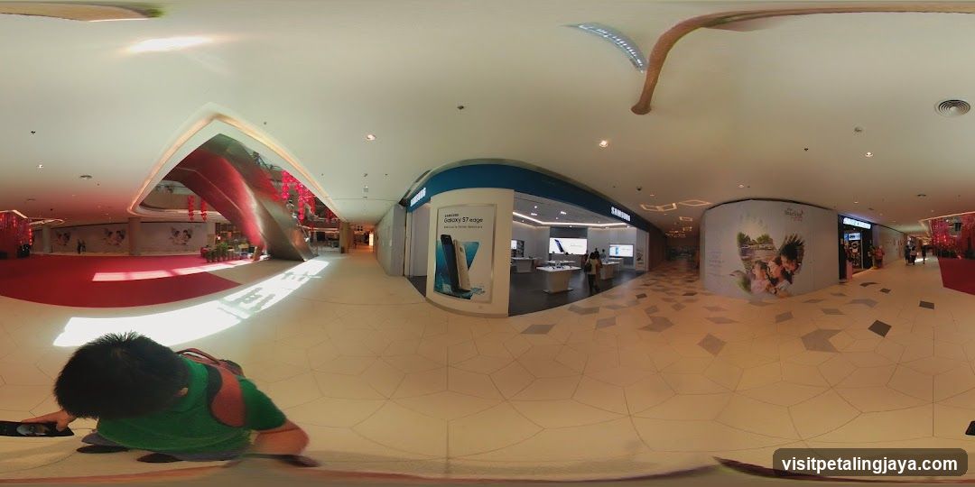 Mall Interior with Storefronts and Advertisements