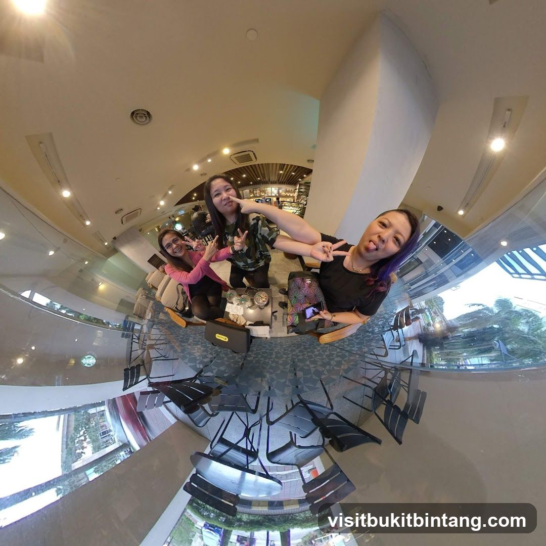 Three friends posing for a photo in a cafe