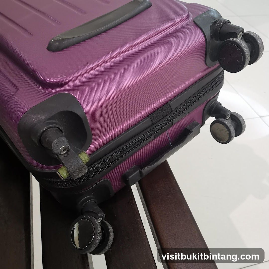 Purple Suitcase on Wooden Bench