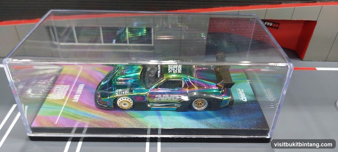 Die-cast car in display case