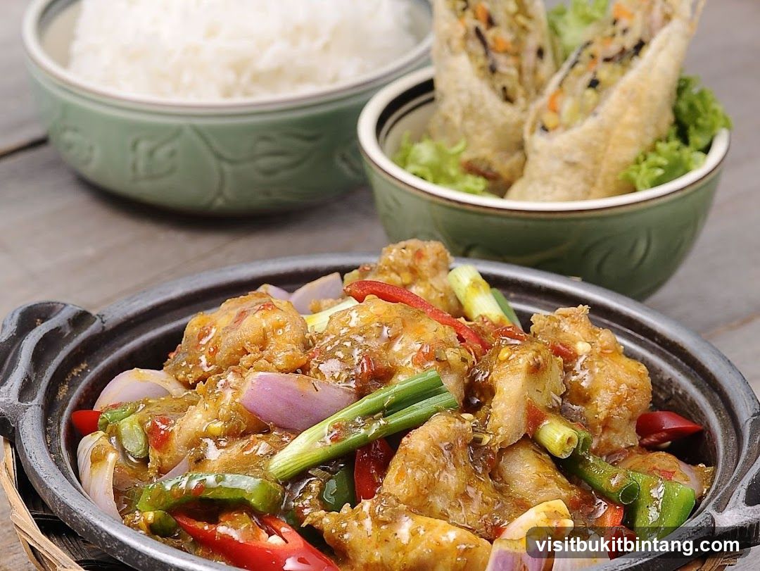 Stir-fried dish with rice and spring rolls