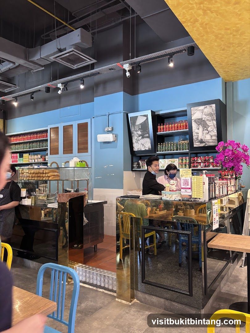 Restaurant Interior with Staff and Shelves of Goods