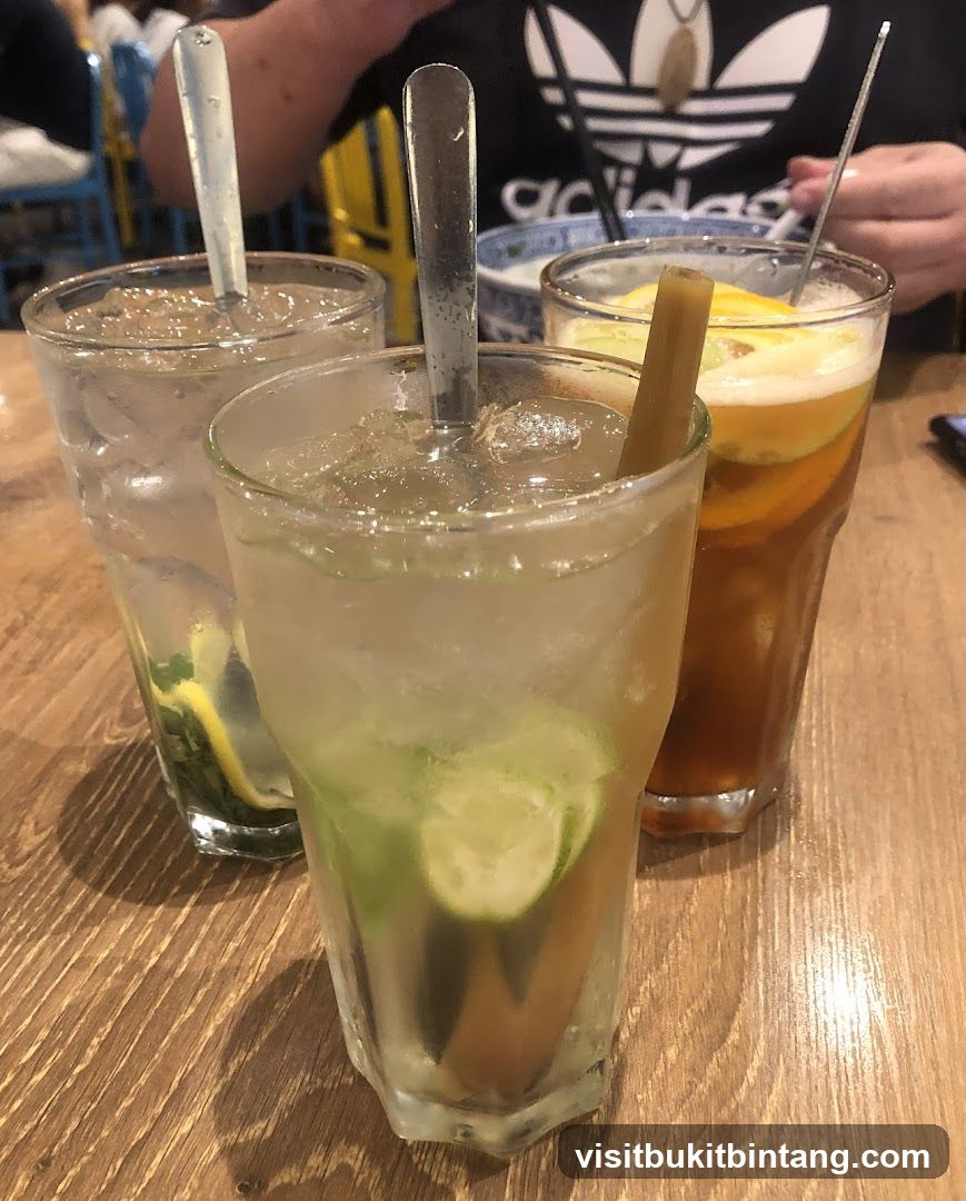 Three refreshing drinks on a wooden table