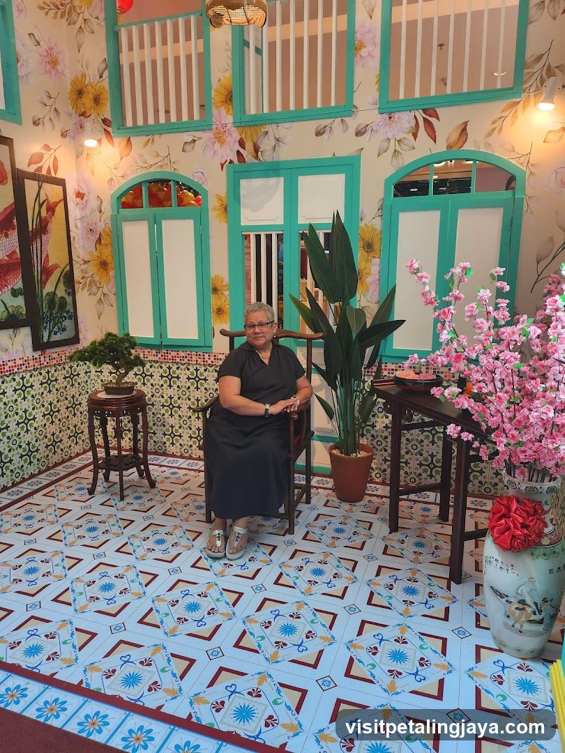 Interior of a decorated room with floral wallpaper and patterned tiles
