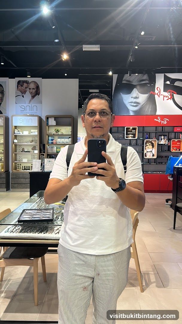 Man taking a selfie in an optical shop