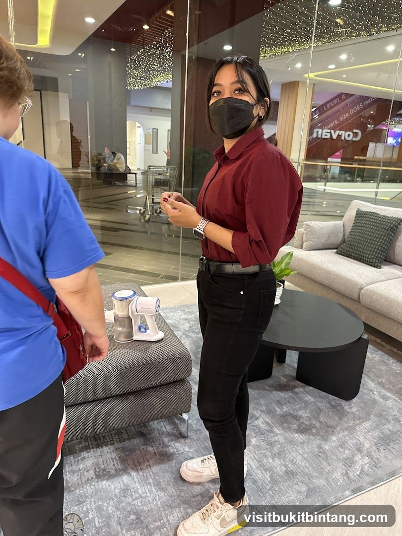 Woman in Maroon Shirt and Black Pants