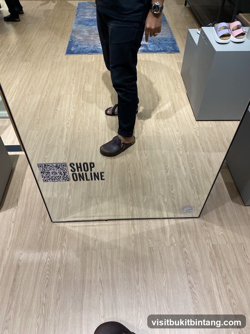 Mirror reflection of shoes and store interior