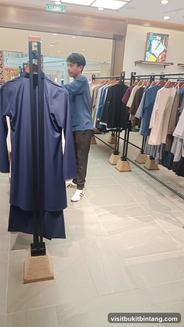 Man browsing clothes in a store