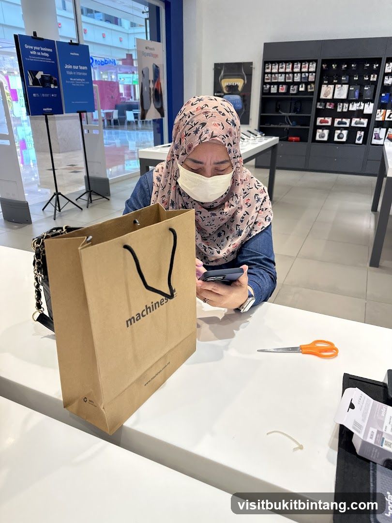 Woman using phone in electronics store