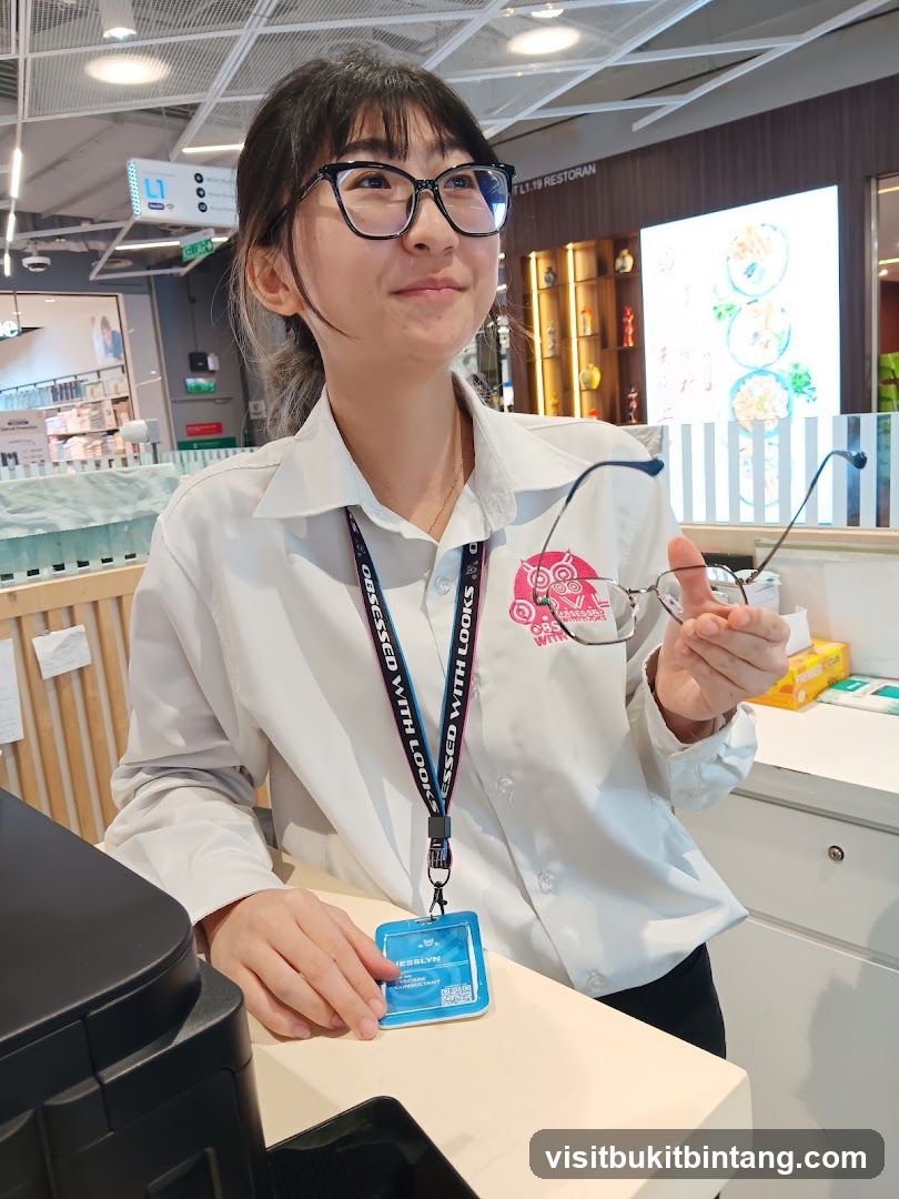 Optician holding glasses