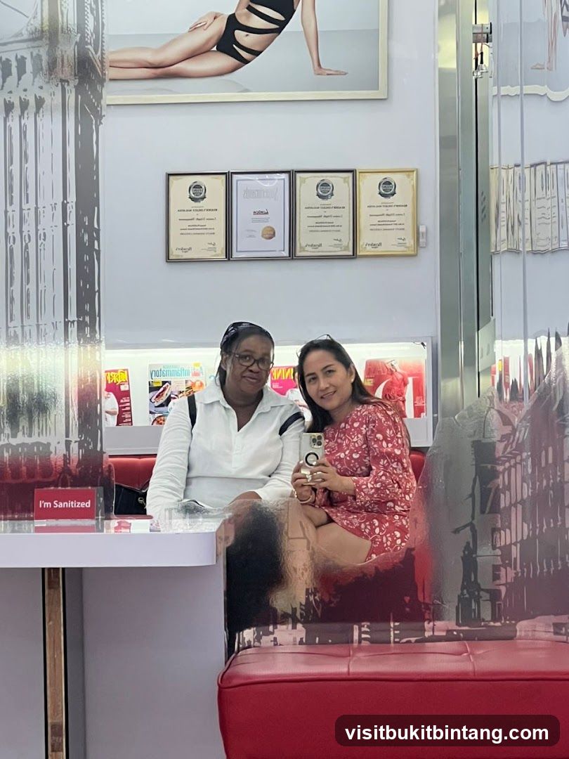 Two women posing for a selfie in a salon