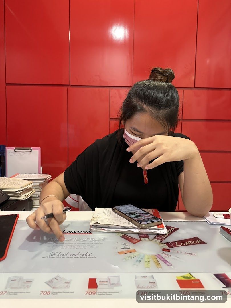 Woman at Desk with London Weight Experts Branding