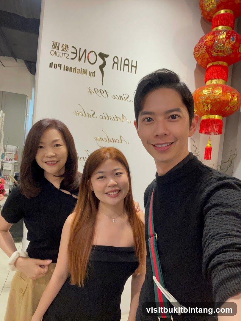 Three people smiling in a salon