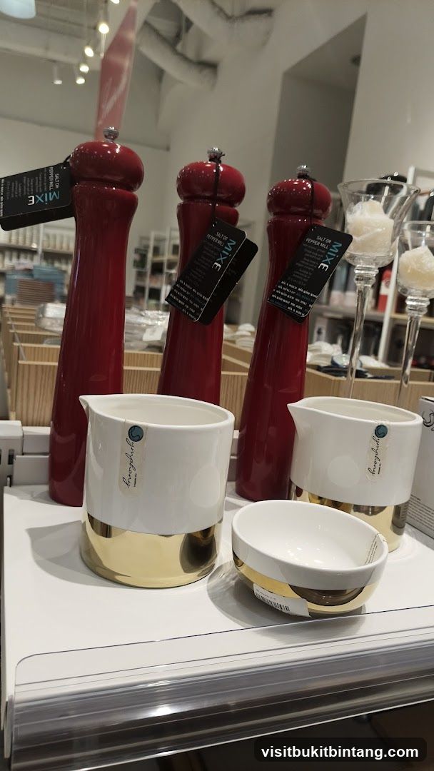 Red Pepper Mills and White Ceramic Pitchers