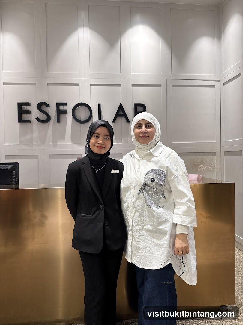Two women standing in front of a reception desk