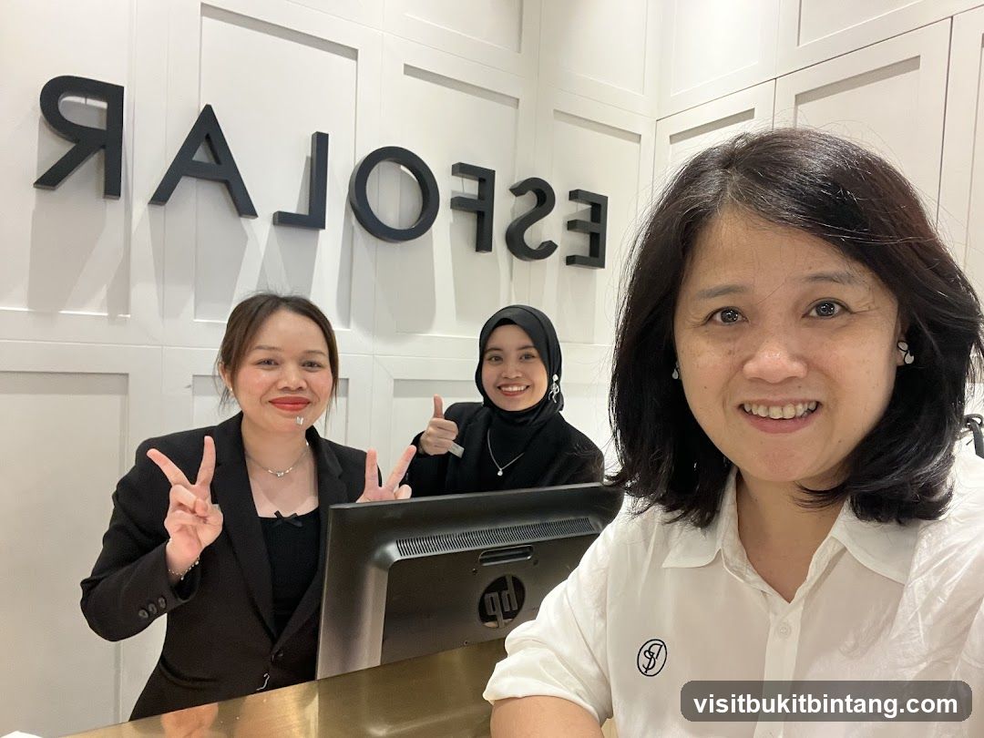Three women smiling at the camera