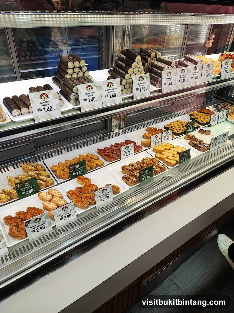 Sushi and other food items in a display case