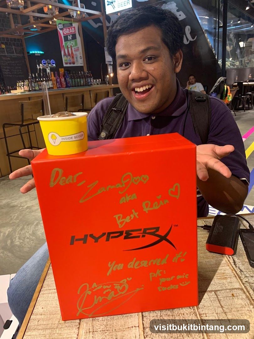 Man with a HyperX box and ice cream