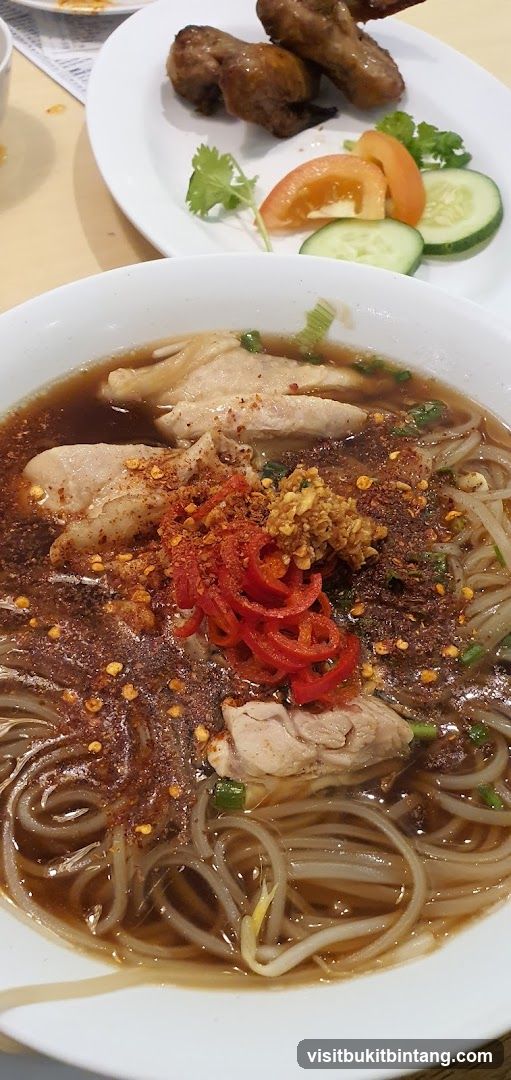 Noodle Soup with Chicken and Side of Meat Skewers