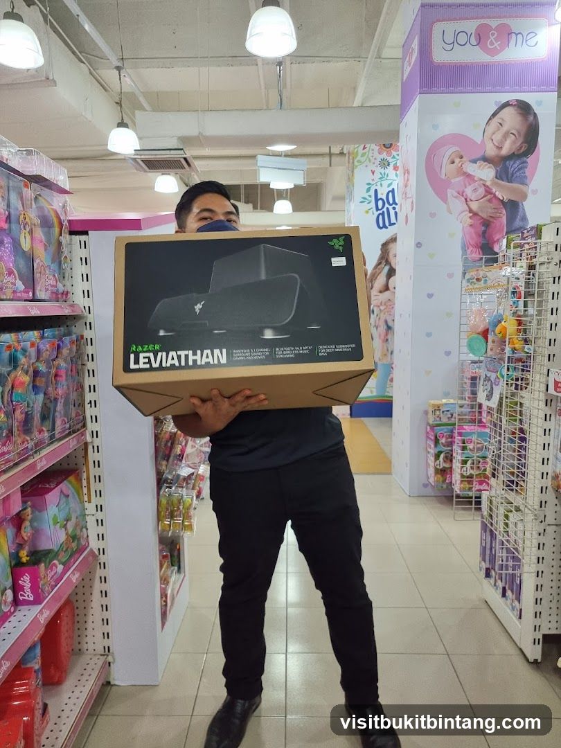 Man holding a Razer Leviathan box in a toy store