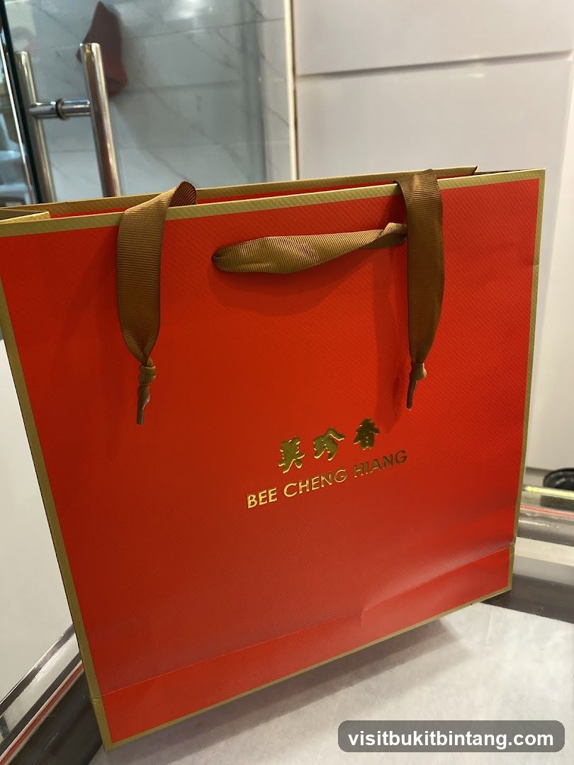 Orange Gift Bag with Gold Logo