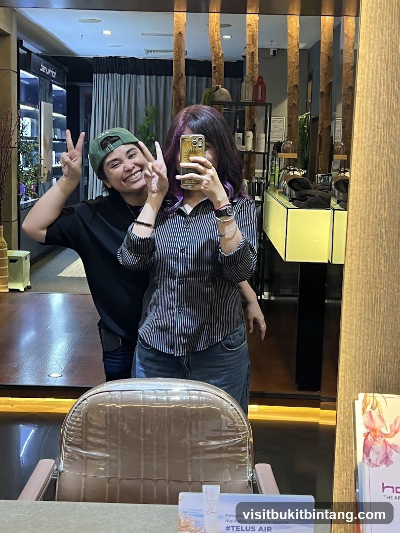 Two people taking a selfie in a salon