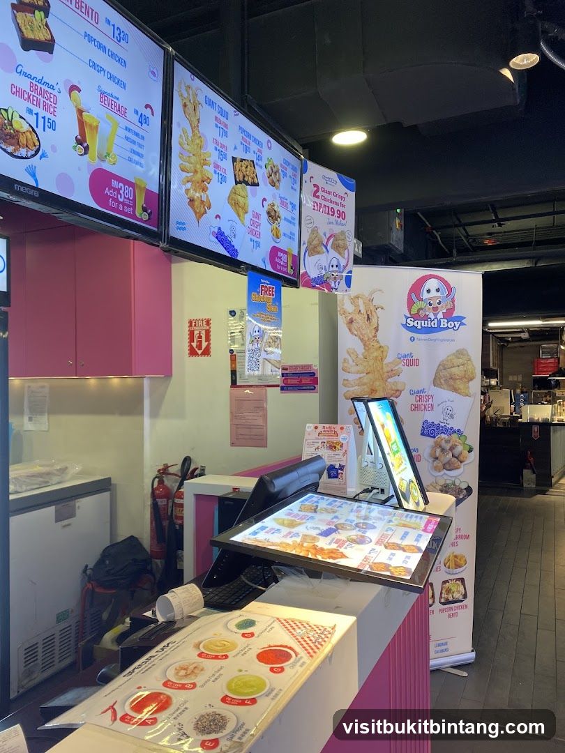 Food counter with digital menus and promotional posters