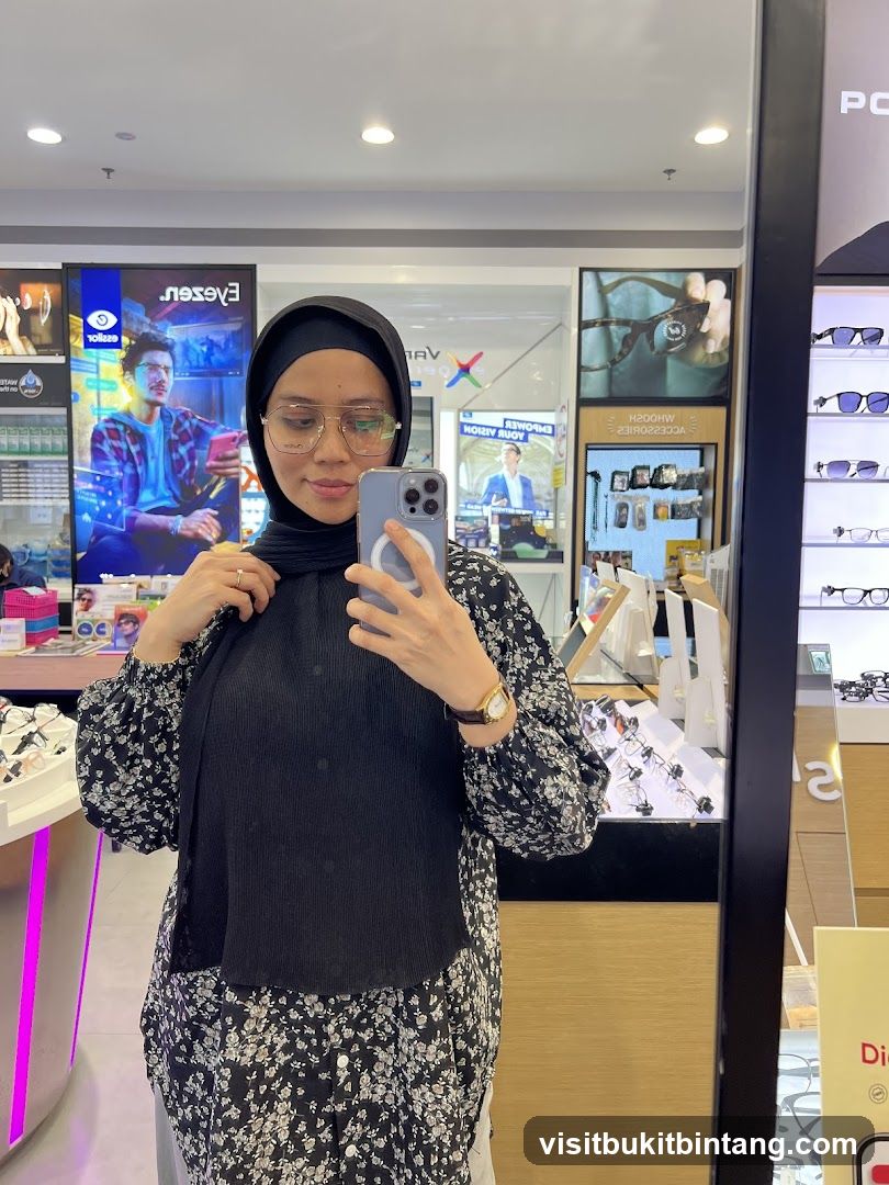 Woman taking a mirror selfie in an optical shop