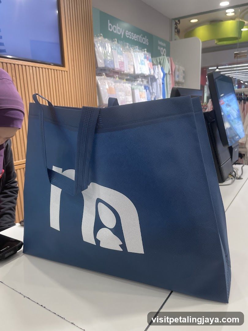 Blue shopping bag with logo on store counter
