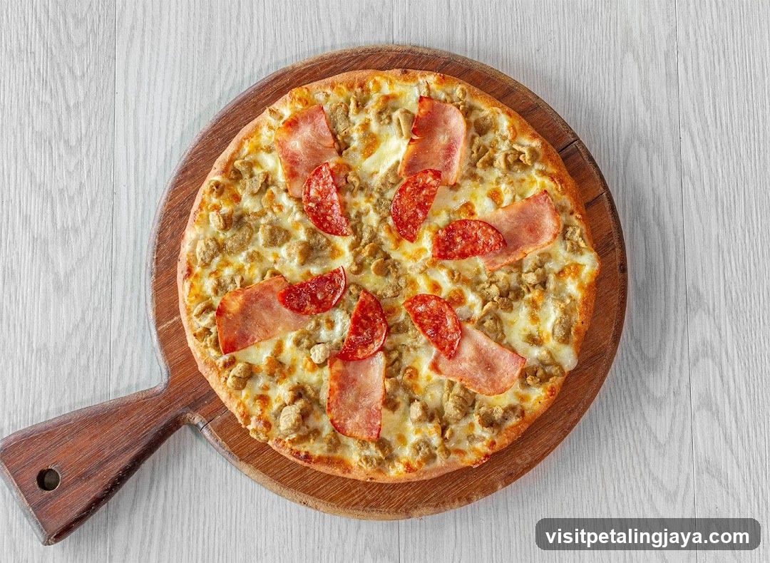 Pizza with Sausage and Pepperoni on Wooden Board