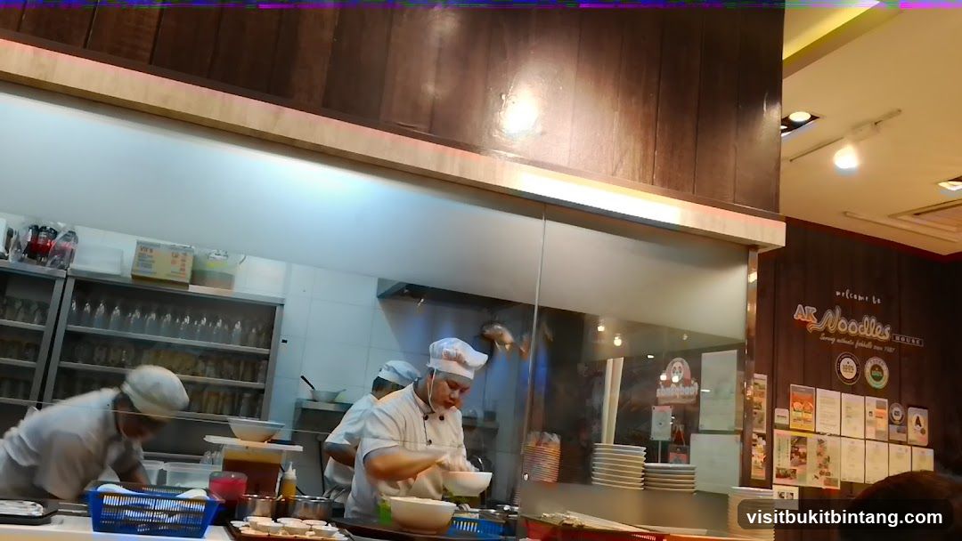 Chefs preparing food in a restaurant kitchen