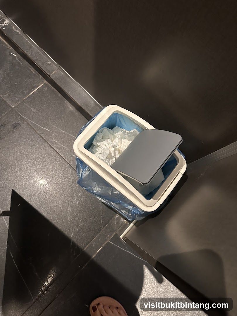 Trash can with crumpled paper