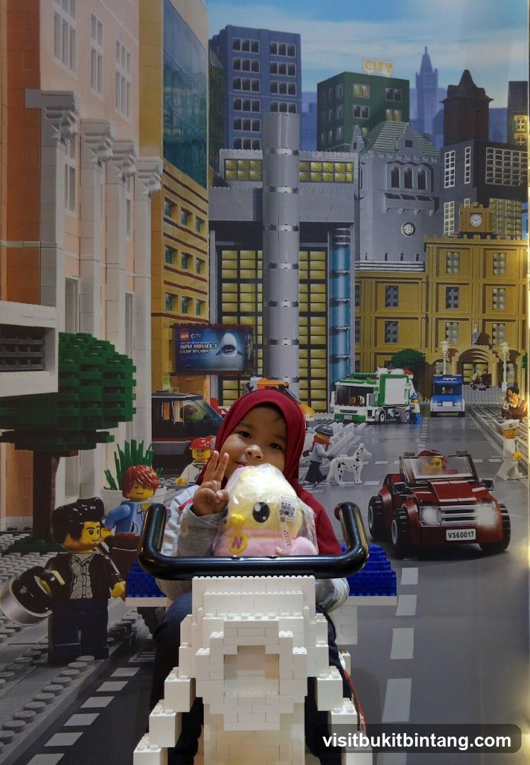 Child Poses with Lego City Backdrop