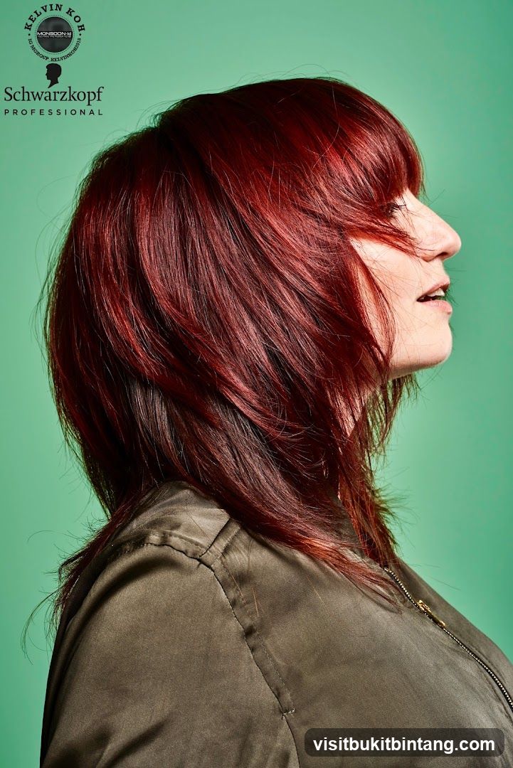 Woman with Red Hair and Schwarzkopf Logo