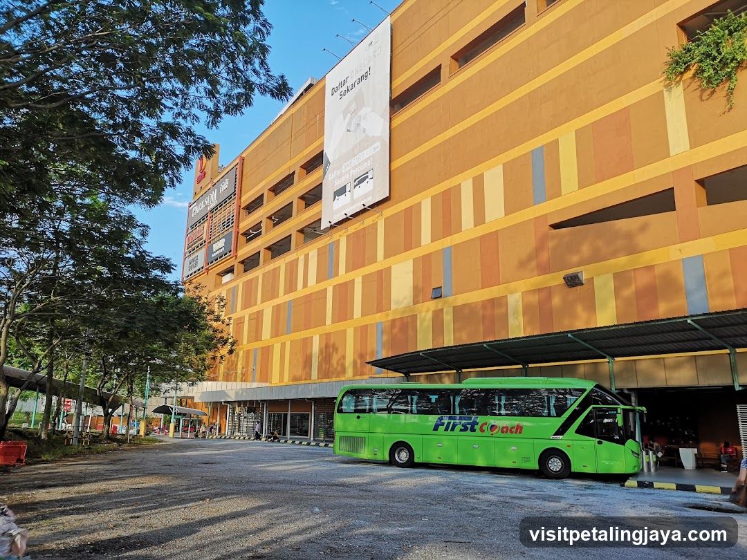 First Coach Bus Outside Shopping Center