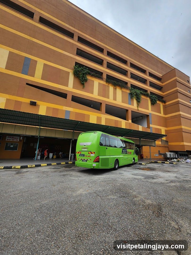 Green Bus at Multi-Story Building Entrance