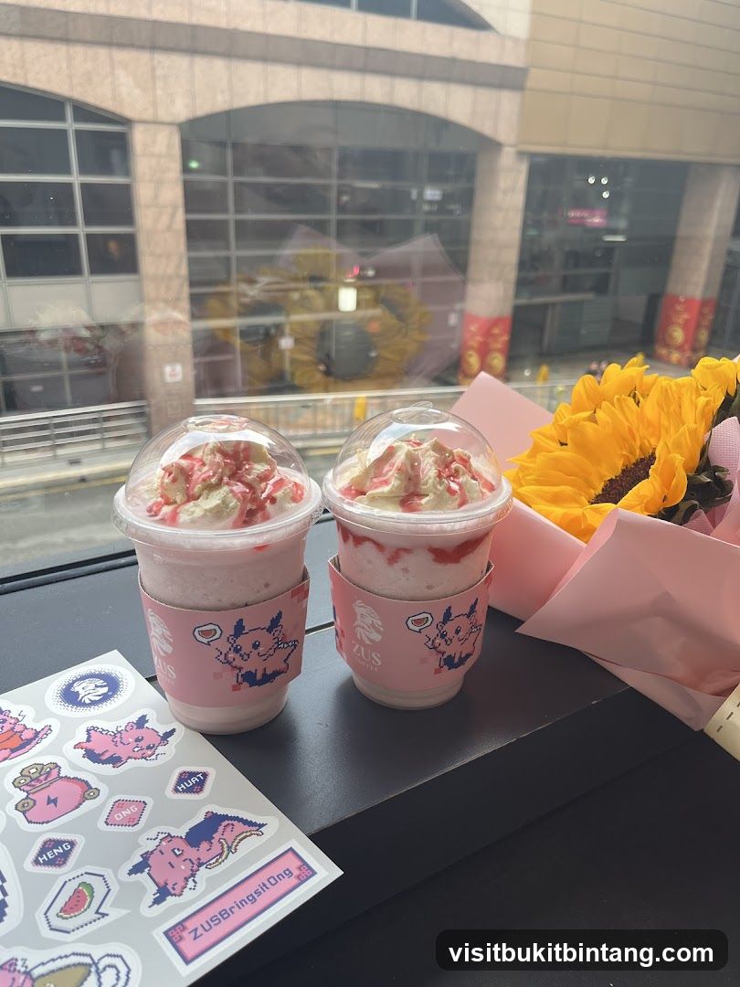 Two strawberry milkshakes with whipped cream and a bouquet of sunflowers
